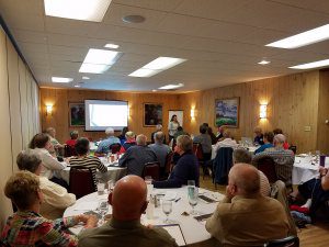 Participants view a presentation on advocacy at a workshop